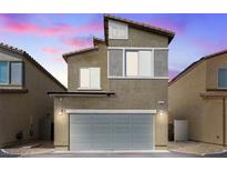 Two-story home with a two-car garage and neutral colored stucco exterior at 4371 Fire Glow Ave, North Las Vegas, NV 89084