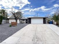 Charming single-story home featuring a long driveway and well-maintained landscaping at 4485 Greenhill Dr, Las Vegas, NV 89121