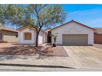 Charming single-story home featuring a two-car garage and low-maintenance desert landscaping at 531 Coolidge Ave, Henderson, NV 89015