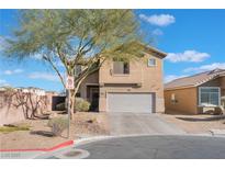 Inviting two-story home featuring a two-car garage, landscaped front yard, and neutral stucco exterior at 6552 Casamar St, North Las Vegas, NV 89086