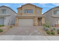 Charming two-story home featuring desert landscaping, brick-paved driveway, and a two-car garage at 7122 Red Gulch St, North Las Vegas, NV 89084