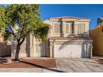 Charming two-story home boasts a well-maintained front yard and classic architectural details under a clear blue sky at 7228 Buglehorn St, Las Vegas, NV 89131
