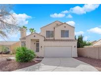 Charming two-story home with a well-maintained front yard and a two-car garage in a residential neighborhood at 7709 Sandridge Ct, Las Vegas, NV 89149