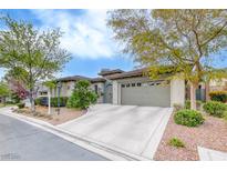 Charming single-story home featuring a spacious driveway and well-manicured landscaping at 10479 Garden Light Dr, Las Vegas, NV 89135