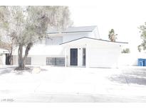 Charming two-story home featuring a well-maintained yard and an attached garage at 109 Breeze Ct, Las Vegas, NV 89145