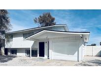Charming two-story home featuring a freshly painted exterior with an attached single-car garage at 109 Breeze Ct, Las Vegas, NV 89145