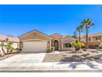 Charming single-story home with a well-manicured front yard and a two-car garage at 1821 Eagle Mesa Ave, Henderson, NV 89012