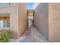 Exterior walkway shows access to units and building design at 2110 Sealion Dr # 101, Las Vegas, NV 89128