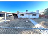 Single-story home featuring a simple architectural style and a front yard at 2208 E Ogden Ave, Las Vegas, NV 89101