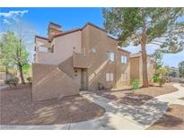 Inviting condo with desert landscaping and an appealing exterior paint scheme at 2983 Juniper Hills Blvd # 103, Las Vegas, NV 89142