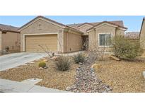 Charming single-story home with desert landscaping, rock accents, and a two-car garage at 3220 Flinthead Dr, North Las Vegas, NV 89084