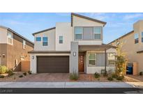 Charming two-story home with a modern design and well-maintained landscaping at 3243 Fountaintree Ave, Henderson, NV 89044