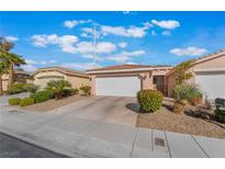 Charming single-story home featuring a two-car garage, desert landscaping, and a tile roof at 4546 Regalo Bello St, Las Vegas, NV 89135