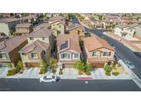 Charming two-story home with a well-maintained lawn and a two-car garage in a Gathering-friendly neighborhood at 10815 Henesco Bay St, Las Vegas, NV 89179