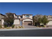 Charming two-story home features desert landscaping, brick driveway, and an attached two-car garage at 2822 Poseidon Shore Ave, Henderson, NV 89052