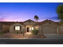 Charming single-story home featuring desert landscaping and a two-car garage at 5577 Golden Leaf Ave, Las Vegas, NV 89122