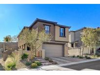 Inviting two-story home with a modern design and a well-maintained front yard at 889 Ariel Heights Ave, Las Vegas, NV 89138