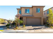 Charming two-story home with a brick driveway, well-maintained landscaping, and a two-car garage at 12381 Liberty Beacon Ave, Las Vegas, NV 89138