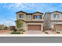 Inviting two-story home with a landscaped front yard and a two-car garage at 1485 Sound Ln, North Las Vegas, NV 89031