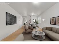 Bright living room featuring modern furnishings and decor, creating a welcoming atmosphere at 4036 W Bird Man Ln, North Las Vegas, NV 89084