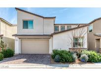 Modern two-story home with a two-car garage and desert landscaping at 9380 Lunar Effect St, Las Vegas, NV 89143