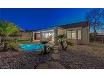 Backyard pool with desert landscaping and covered patio for outdoor entertaining at 2820 Thunder Bay Ave, Henderson, NV 89052