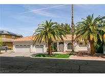 Charming single-story home with a three-car garage, well-maintained lawn, and mature palm trees at 3684 Miguels Ln, Las Vegas, NV 89120