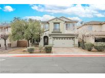 Charming two-story home with a well-manicured lawn, a driveway, and attached two-car garage at 3721 Moonshine Falls Ave, North Las Vegas, NV 89085