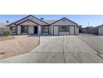 Charming single-story home featuring a low maintenance yard and a spacious driveway at 4629 Cattleman Ave, North Las Vegas, NV 89031