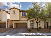 Inviting two-story home with a well-manicured front yard and a welcoming entrance at 8501 Bellery Ave, Las Vegas, NV 89143
