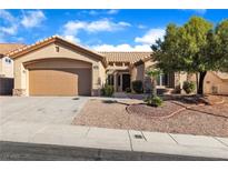 Charming single-story home featuring a two-car garage and drought-tolerant landscaping at 10408 Georgetown Pl, Las Vegas, NV 89134