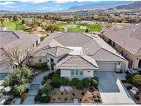 Stunning exterior elevation showcasing the desert landscaping and beautiful tile roof at 11321 Golden Chestnut Pl, Las Vegas, NV 89135