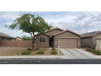 Charming single-story home with a two-car garage and desert landscaping at 1926 Neoga St, Las Vegas, NV 89115