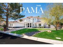 Stunning two-story home with a beautifully landscaped front yard and circular driveway at 3465 Pama Ln, Las Vegas, NV 89120