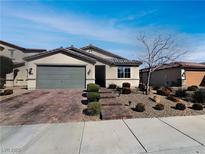 Charming single-story home featuring a low-maintenance front yard and a two-car garage at 3726 Shaving Shadows Ave, North Las Vegas, NV 89032