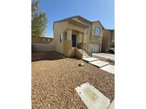 Charming home with a landscaped front yard and a welcoming front porch at 4056 Blue Wildrye St, Las Vegas, NV 89122