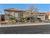 Charming single-story home with a well-maintained desert-landscaped front yard and a two-car garage at 7232 Frontier Hills Ave, Las Vegas, NV 89113
