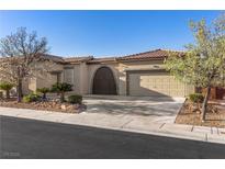 Charming single-story home featuring desert landscaping and a tile roof at 7232 Frontier Hills Ave, Las Vegas, NV 89113