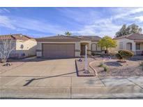 Inviting single-story home with a two-car garage and desert landscaping in front yard at 120 Montesol Dr, Henderson, NV 89012