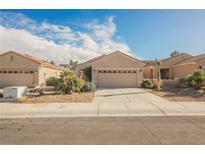 Charming single-story home featuring a two-car garage and low-maintenance landscaping in a desirable community at 2147 Indigo Creek Ave, Henderson, NV 89012