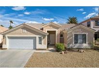 Charming single-story home featuring desert landscaping and a two-car garage at 33 Chateau Whistler Ct, Las Vegas, NV 89148