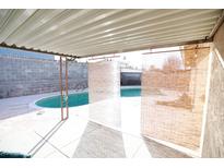 Enjoy the private backyard oasis with covered patio and sparkling pool for outdoor relaxation and entertainment at 3905 E Cherokee Ave, Las Vegas, NV 89121