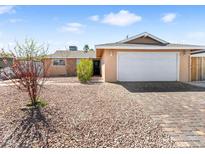 Charming single-story home with low maintenance desert landscaping and a two-car garage at 6117 Borden Cir, Las Vegas, NV 89107