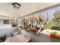 Inviting balcony with flower boxes and a cozy seating area overlooking lush greenery at 778 Oakmont Ave # 312, Las Vegas, NV 89109