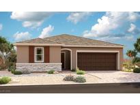 Charming single-story home featuring stone accents, a two-car garage, and desert landscaping at 10233 Tumbaga St, Las Vegas, NV 89183