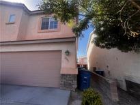 Charming home featuring a two-car garage and well-maintained stucco exterior at 2105 William Holden Ct, Las Vegas, NV 89142