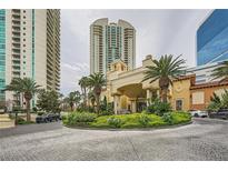 Stunning building exterior featuring a grand entrance with palm trees and manicured landscaping at 2857 Paradise Rd # 2704, Las Vegas, NV 89109
