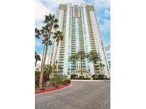 Luxury high-rise exterior showcasing a modern design with palm trees and well-maintained landscaping at 2877 Paradise Rd # 104, Las Vegas, NV 89109