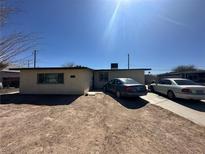 Modest single-story home featuring a simple facade and a spacious dirt front yard at 3709 Perliter Ave, North Las Vegas, NV 89030