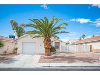 Charming single-story home with a well-manicured front yard featuring a mature palm tree at 5325 Jose Ernesto St, North Las Vegas, NV 89031